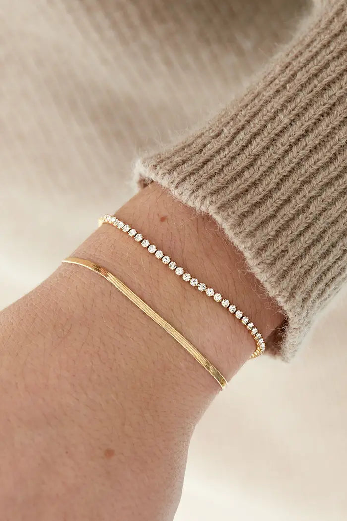 Gouden Zilveren dubbele armband met sprankelende diamantjes.