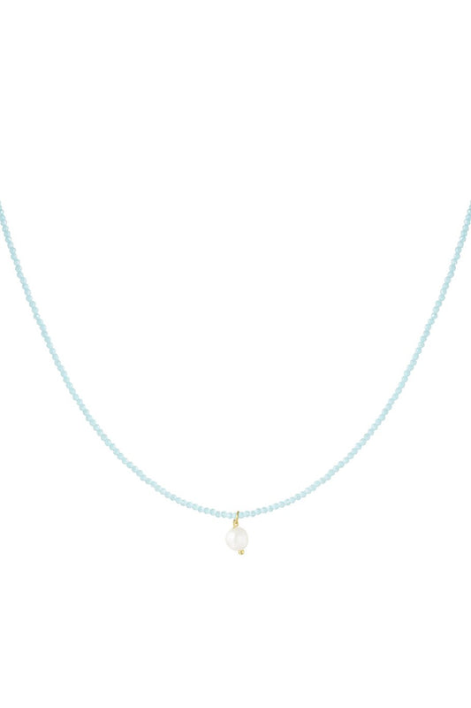 Elegante goudkleurige ketting met glanzende parel, perfect voor een chique en vrouwelijke look.